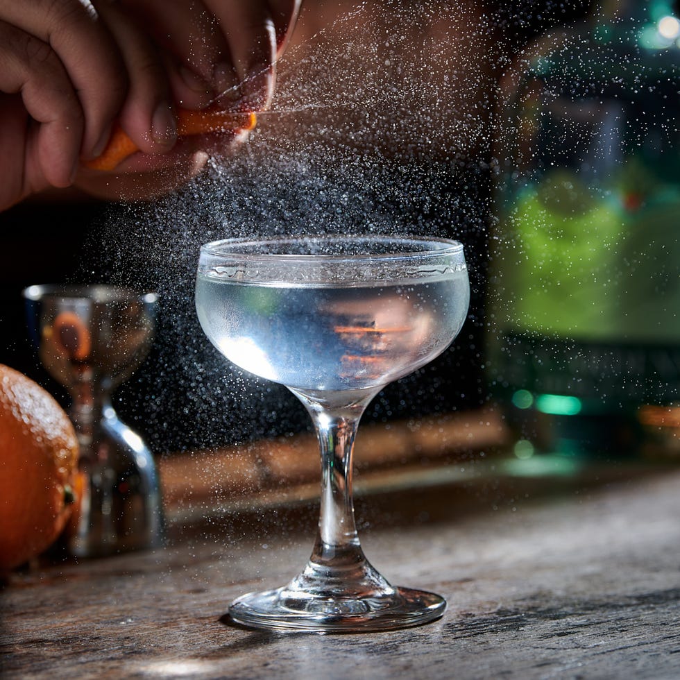 a hand holding a glass of water