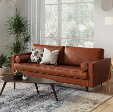 a living room with a couch and coffee table