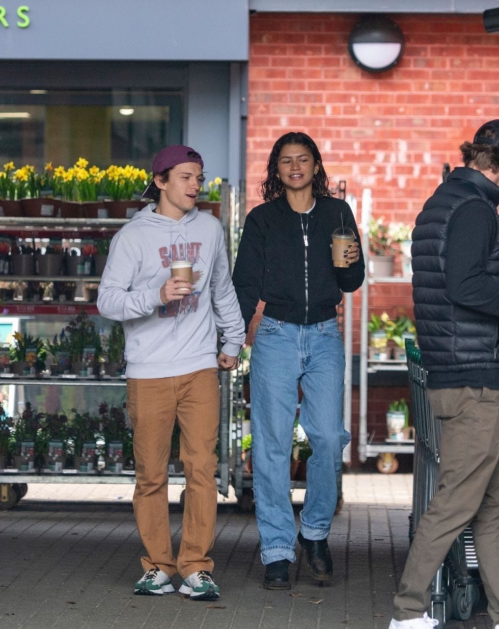 a couple of men holding drinks