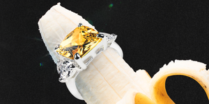 a yellow diamond engagement ring on a peeled banana