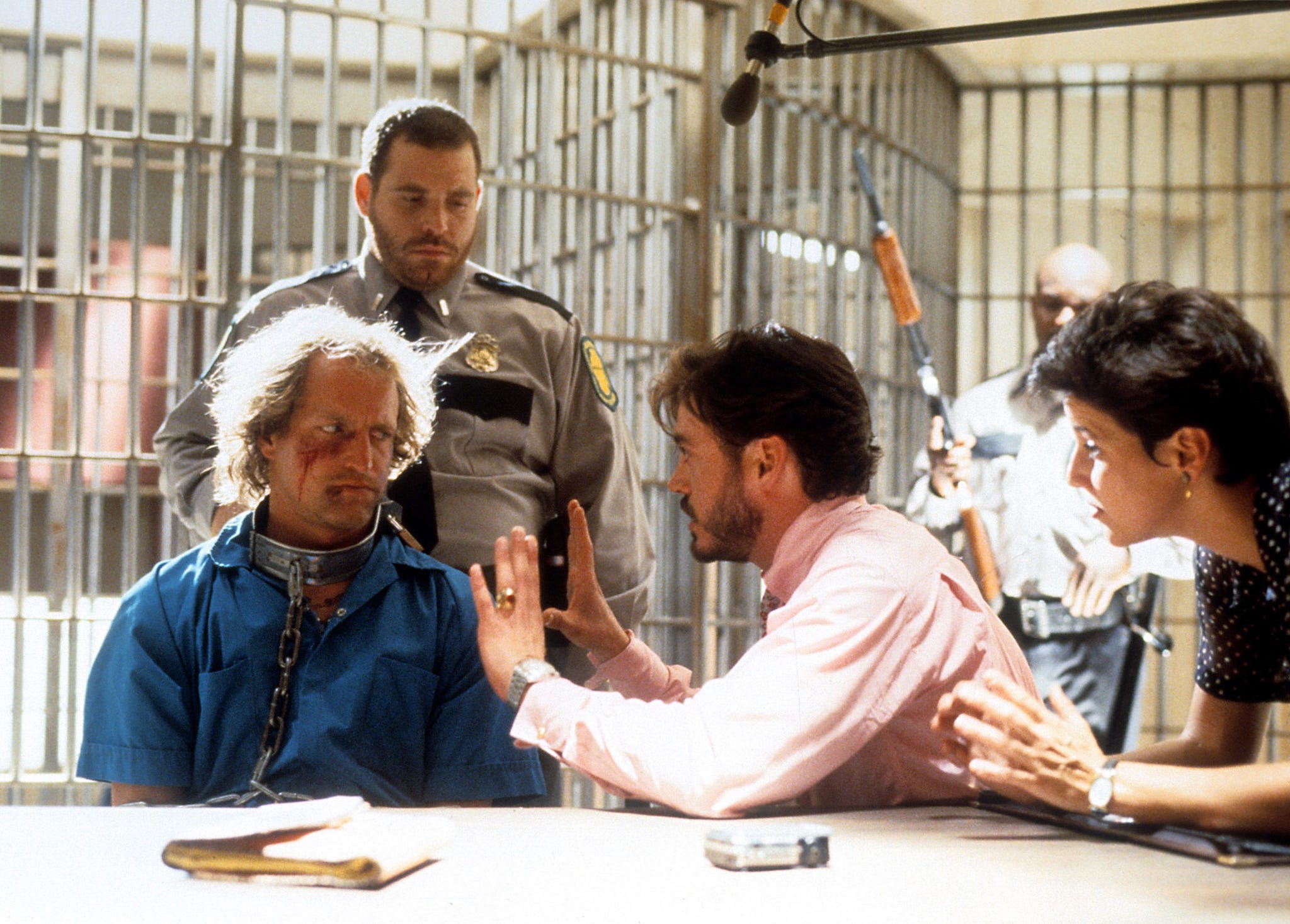 woody harrelson sits in jail with robert downey jr in a scene from the film 'natural born killers', 1994 photo by warner brothersgetty images