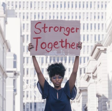 street, protest and cardboard of black woman sign for solidarity, gender equality and power in government, politics and law revolution, justice and city student with poster portrait for human rights