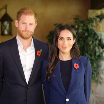 two individuals in formal attire standing close together