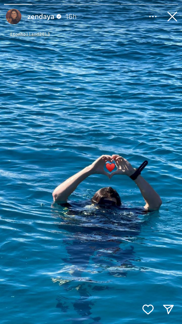 a person swimming with a ball