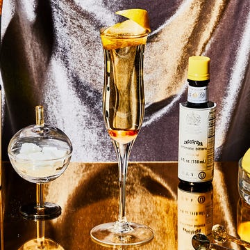 Yellow, Alcohol, Drink, Distilled beverage, Alcoholic beverage, Liqueur, Champagne, Liquid, Glass bottle, Champagne stemware, 