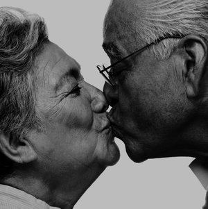 old man kissing older woman