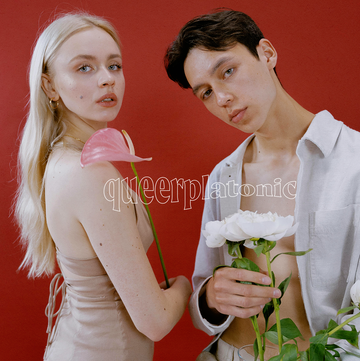 a man and woman holding flowers