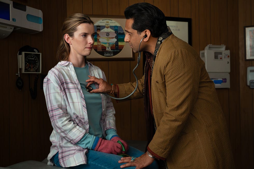 betty gilpin as lina and ravi patel as her dr henry in three women