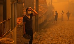 A woman next to her home in Covelo, Gondomar, northern Portugal.