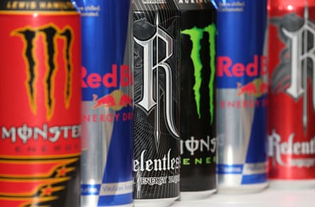 A row of colorful energy drinks on a shelf: Monster, Red Bull and Relentless