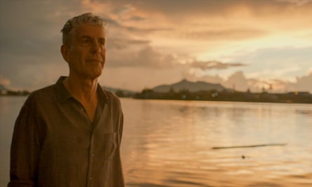 A man who is Anthony Bourdain stands by the water