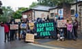 Protesters hold sign saying 'forests are not fuel' outside Fulford police station in York