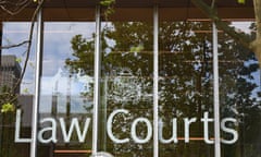 A 'law courts' sign in an Australian court building window