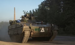 Ukrainian service personnel in an armoured personnel carrier