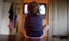 Young girl watching television, close up<br>CN2JX9 Young girl watching television, close up