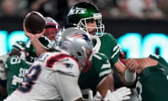 New York Jets quarterback Aaron Rodgers passes against the New England Patriots during the second quarter of Thursday’s game.