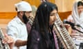 Sikh musicians playing traditional instruments