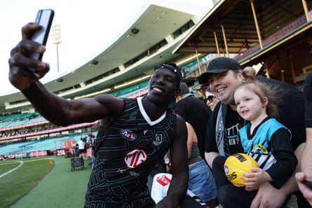 Aliir Aliir with Power fans at the SCG on Thursday.