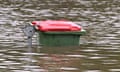 A submerged rubbish bin on the Gold Coast following flash floods in 2023. 