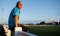 Brooke Aspin sits on a railing by the side of the pitch at Bristol City’s training ground