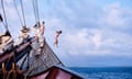 Two members of the crew take a celebratory leap from the jib boom, at their destination, Martinique, from a height of 7.5 metres