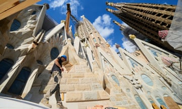 Construction workers walking on the roof of the Sagrada Família