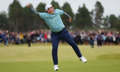 A jubilant Robert MacIntyre celebrates victory on the 18th green