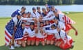 The US team and their captain Stacy Lewis lift the Solheim Cup trophy.