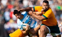 Argentina's Los Pumas centre Lucio Cinti is tackled by Australia's Wallabies prop Taniela Tupou and centre Hamish Stewart