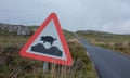 A road sign warning of pigs on the road in Raasay, Inner Hebrides