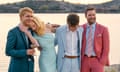 Billy Howle, Nicole Kidman, Sam Nivola and Jack Reynor link arms in a scene from The Perfect Couple, set on a beach.