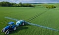 Tractor Spraying Crop With Pesticide