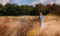 Writer Chloe Dalton, standing in a field of brown grasses