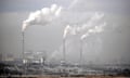 Smoke billows from chimneys of a coal-fired power station