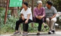 Three women sitting on a bench in China