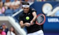 Taylor Fritz returns a shot against Alexander Zverev.