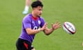 Marcus Smith gets ready to catch a rugby ball during England training in Girona.