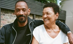 Darcus Beese with his arm around his mother Barbara, who is smiling at him