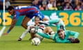 Crystal Palace's Dean Henderson makes a save as Manchester United's Alejandro Garnacho looks on.