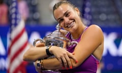 Aryna Sabalenka hugs the US Open trophy.