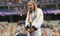 Georgia Bell celebrates on the podium with her bronze medal