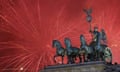 Fireworks light the sky above the Brandenburg Gate shortly after midnight in Berlin, Friday, Jan. 1, 2016. Hundred of thousands of people gathered for the New Year celebrations, welcoming the new year 2016 at the area around the Brandenburg Gate in the capital of Germany. (AP Photo/Markus Schreiber)