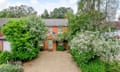 A pretty two-storey house set back from the road