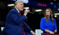 Republican presidential candidate Donald Trump on stage with Arkansas governor Sarah Huckabee Sanders during a town hall event in Flint, Michigan.