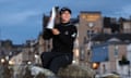 Lydia Ko poses with the AIG Women’s Open trophy on St Andrews’ famous Swilcan Bridge.