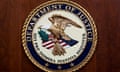 The seal of the US Department of Justice featuring a bald eagle and the American flag