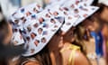 Spectators wear bucket hats with images of top players while watching a match at the US Open.