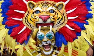 A Colombia football fan in a colourful costume