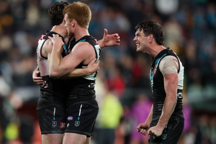 Connor Rozee, Willem Drew and Zak Butters celebrate Port Adelaide’s victory over Hawthorn in a 2024 AFL semi-final