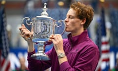 Jannik Sinner kisses the US Open trophy after his victory.